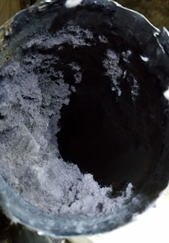 clogged dryer vent before being cleaned