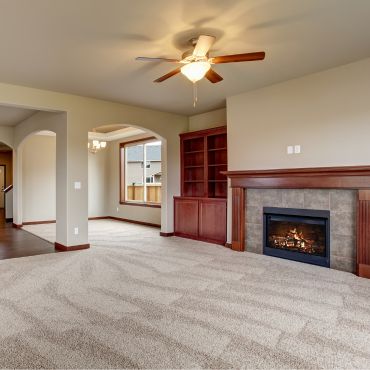 a beautiful living room with cream carpet